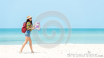 Happy traveler and tourism women travel summer on the beach.Â  Stock Photo